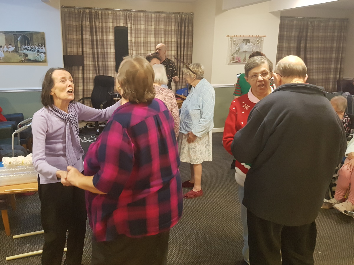 Carehomesuk's tweet photo. The Christmas party at Agnes and Arthur went off with a bang as Glyn Jones entertained residents and visitors 🎉🎄🎶👨‍🎤

#MeaningfulActivities #Xmas #DementiaCare #MusicTherapy https://t.co/LuymoqRQCf