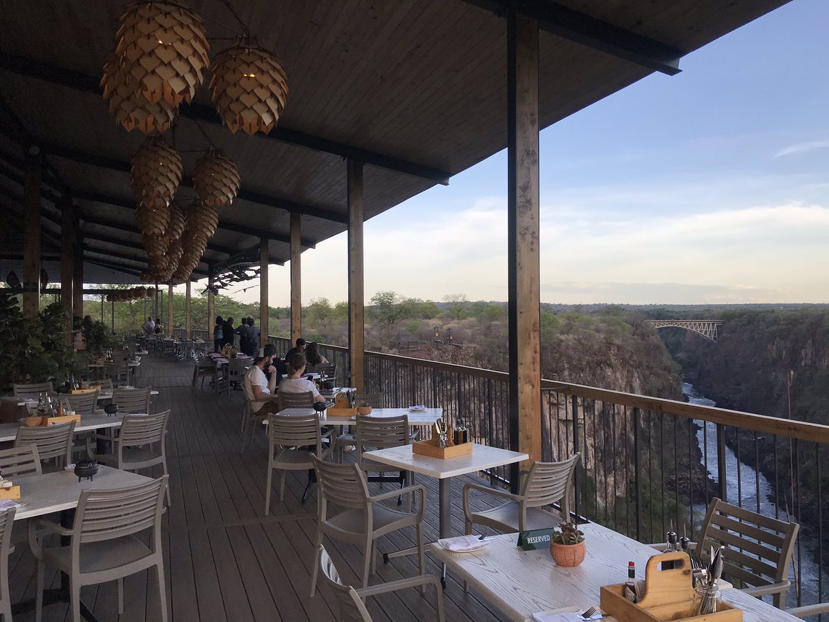 EChinene's tweet photo. Enjoying Beautiful chill out places in Victoria Falls. Pleasant views of the natural landscaping, Gorges, Zambezi River and the Bridge #theLookOutCafe https://t.co/1i9hkfsnOI