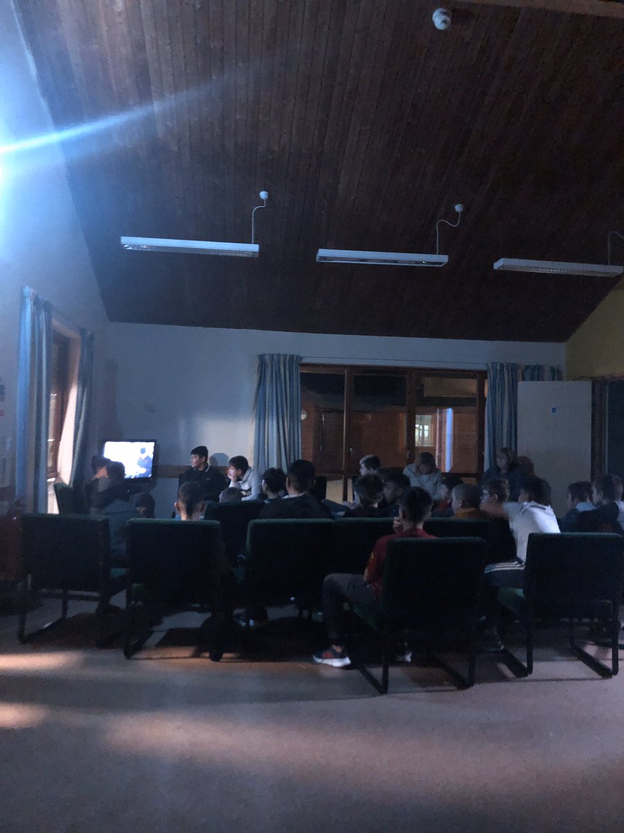 Boys enjoying a film before dinner.
