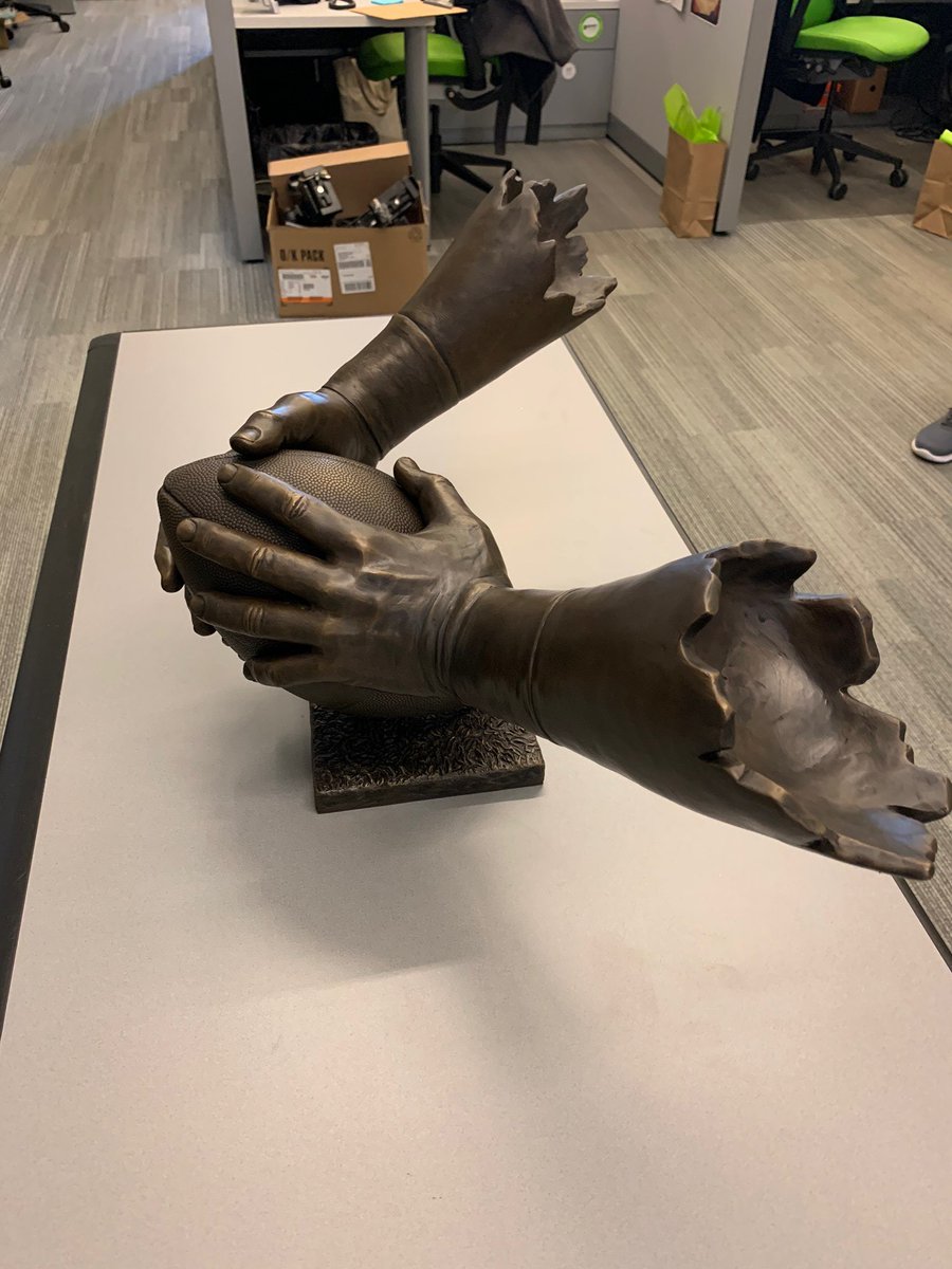 It might just be us, but we believe we have never seen a more beautiful trophy!

Yes, it is completely molded off the exact specifications of Patrick Mannelly’s hands and arms.  

Long Snappers, this is for you!