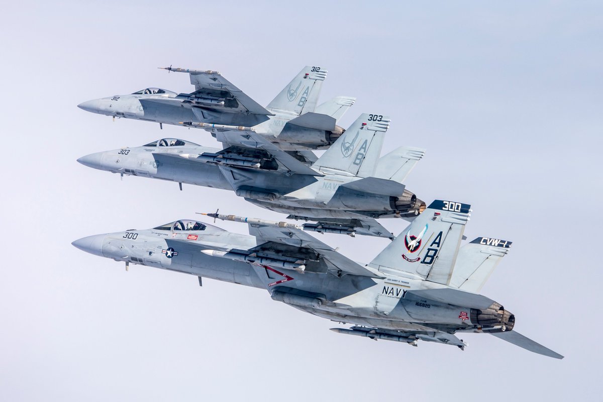 Three F/A-18E Super Hornets from the #Knighthawks of #VFA136 Strike Fighter Squadron 136 seen in gorgeous shots by LCDR Darin Russell, taken last March over the Sea Test Range near #NASLemoore Naval Air Station Lemoore, California