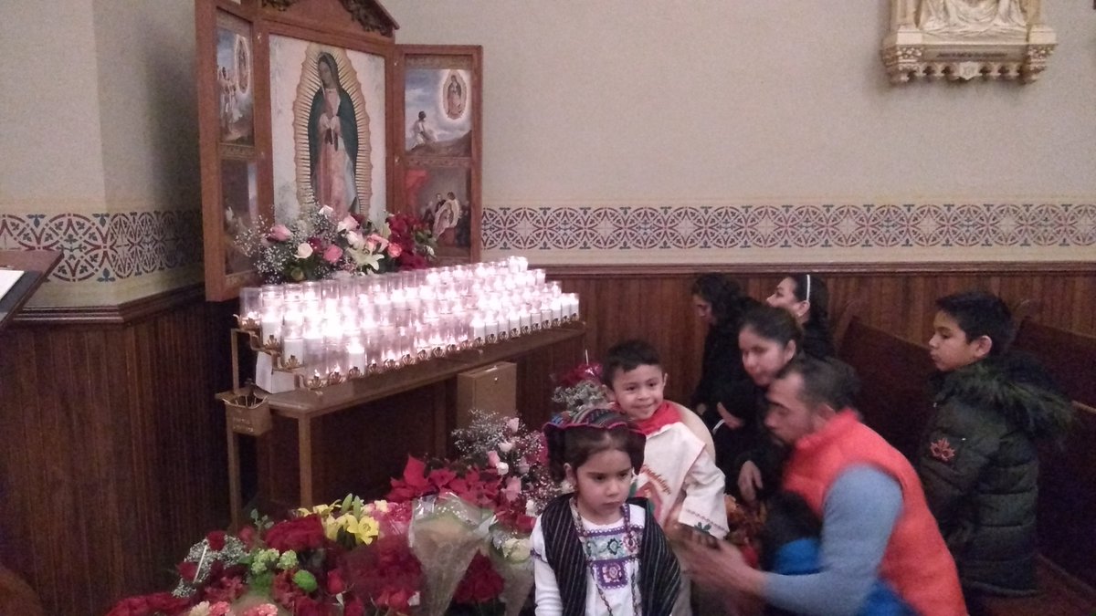 Parishioners venerate the image of Our Lady of Guadalupe following Mass at Cathedral of the Epiphany in Sioux City.  #NWIowaCatholic