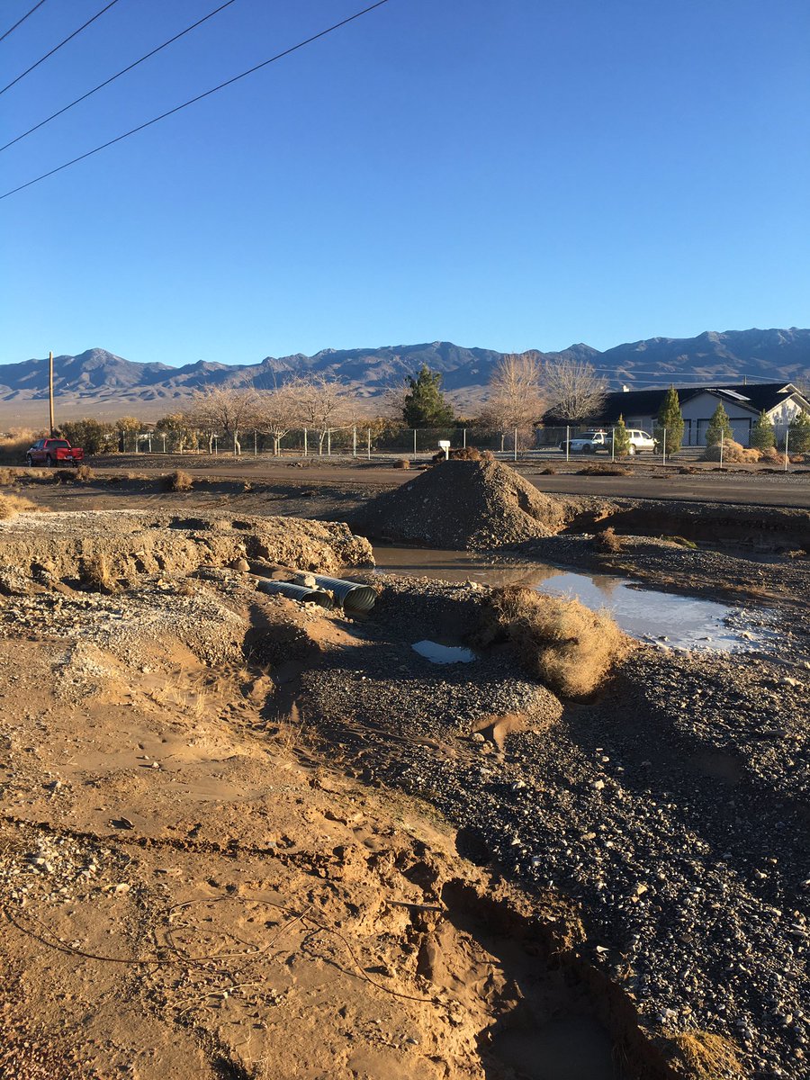 This made for a crappy night.  A few nights ago we were hit by a heavy rain storm that caused a ton of flooding in parts of the valley.  Here’s my driveway being repaired the next day.  Over 120 tons of dirt to do a temporary fix.