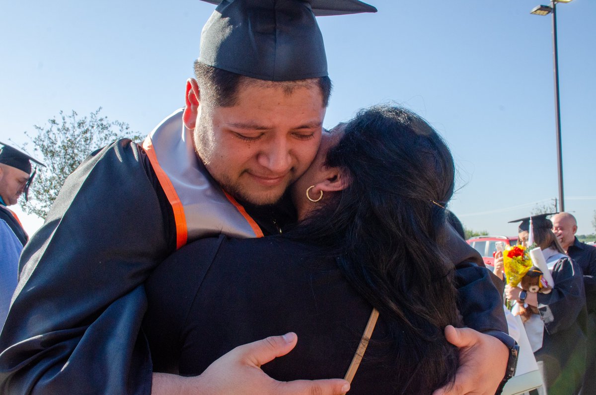 Graduate hug