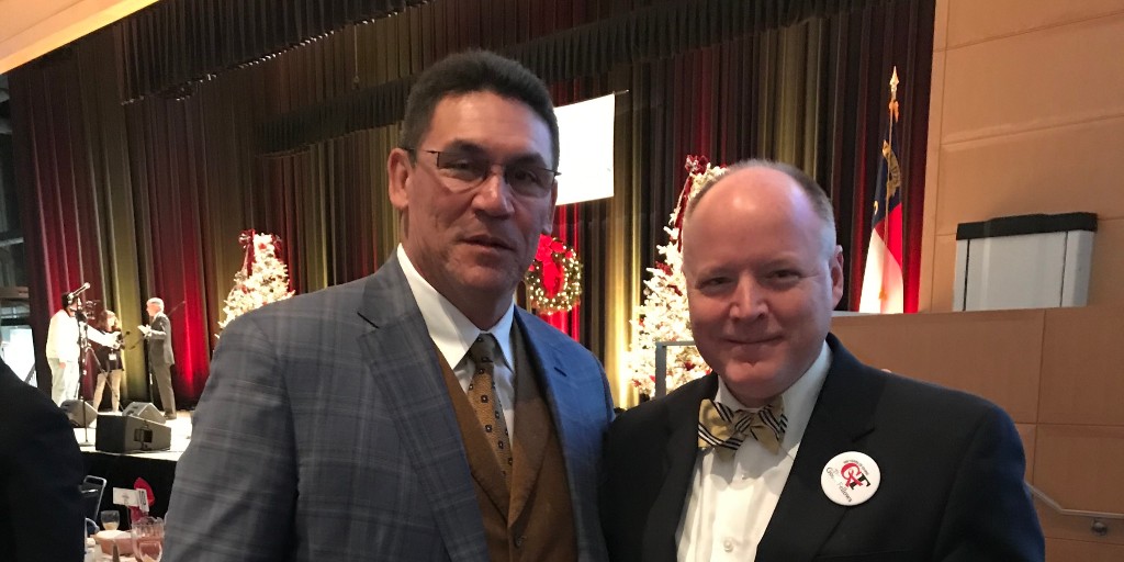 Truliant's tweet photo. Our very own Tim McWhirter, with @RiverboatRonHC at the Good Fellows Club of Charlotte, Holiday Luncheon. Truliant wants to take the time to thank Coach Rivera for his time with the @Panthers & for all his work in the Charlotte community. #TeamTruliant #TruCommunity https://t.co/WNc0FMwfrM