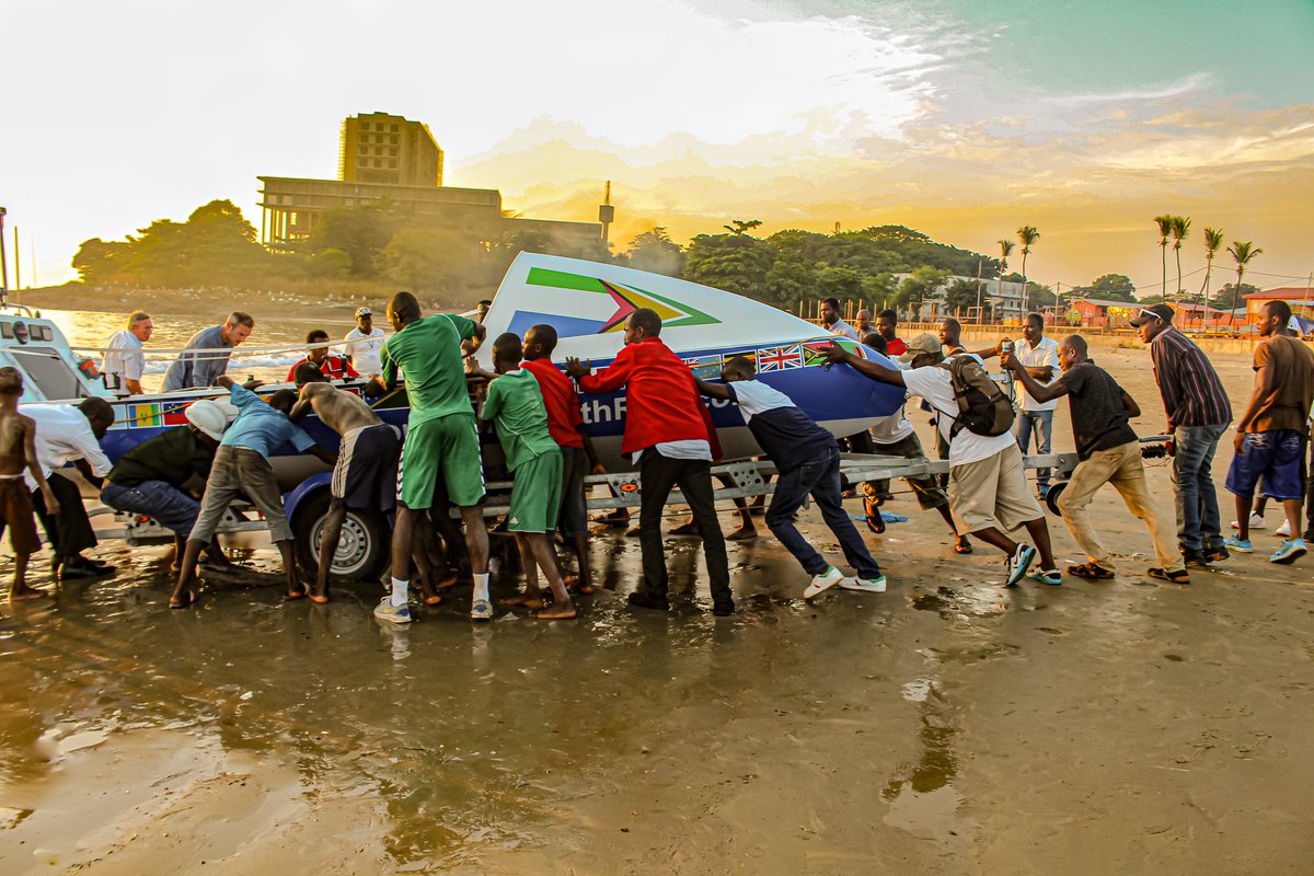 CommonwealthRow's tweet photo. A Year Ago Today! Around 1730 GMT / #Freetown, we started the process of getting Tamu’kke into the water. With no gin-soaked #marina it took the kindness of locals heaving the trailer across the Freetown’s golden sands and starting #CommonwealthRow. #Thankyou #SierraLeone https://t.co/PAcAATryzw