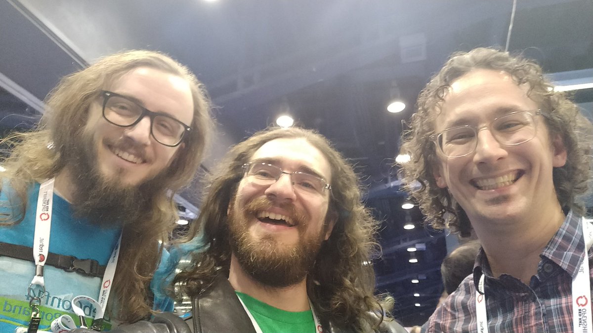 Three fellows with somewhat matching long wavy hair: Tianon, Jérôme, Vincent