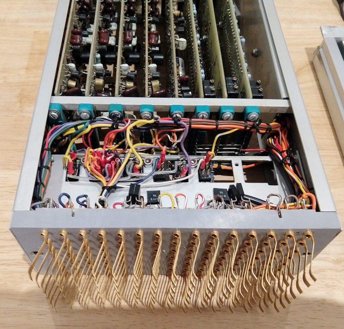 One of the modules from the analog computer. It has a bunch of circuit boards, as well as gold-plated fingers on the front to connect with the patch cords.