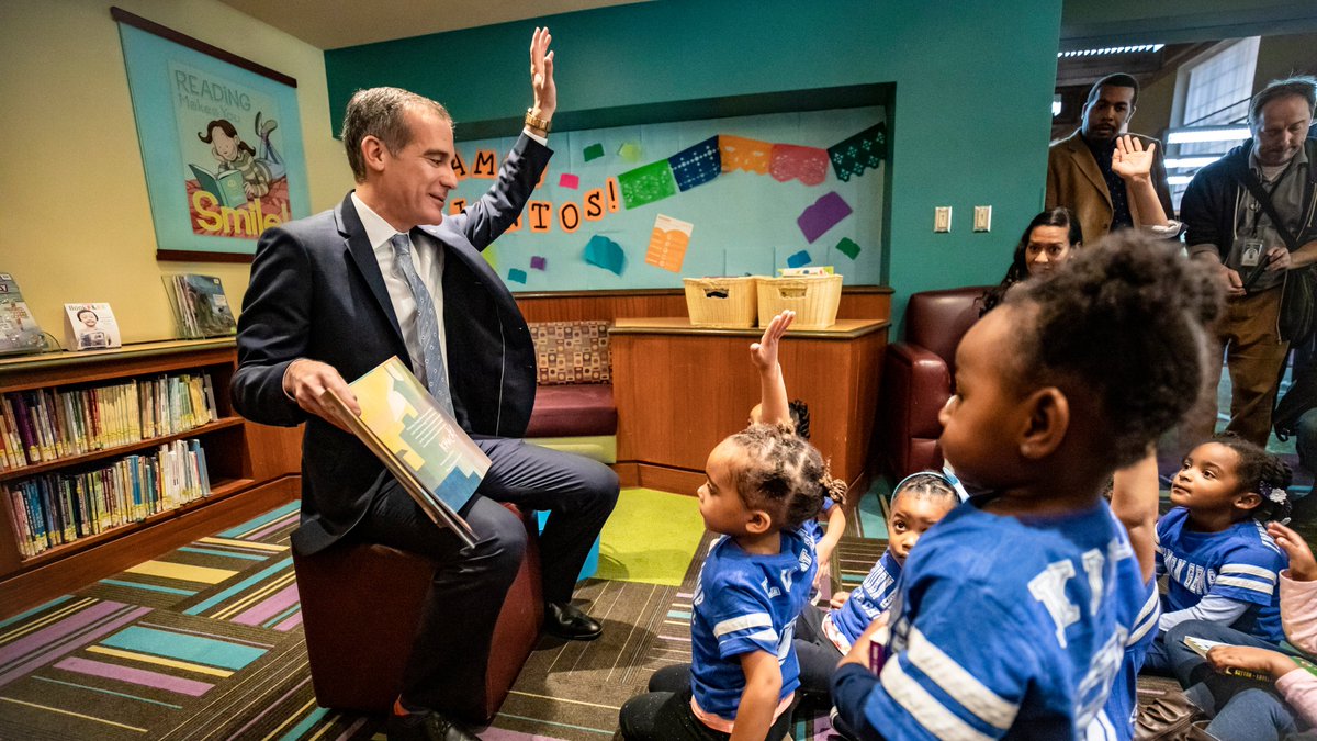 Mayor Garcetti reading to children in a library