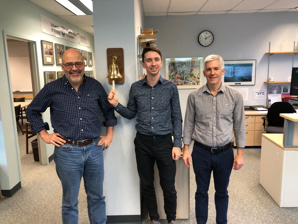IesvicU's tweet photo. Jeff English will be celebrating his excellent PhD defense today: "Decarbonization Pathways for the Western Canadian Electricity System." Pictured here ringing the Bell of Success with two of his supervisors, Andrew and Peter. Nice work Jeff! https://t.co/EbEttwFsVy