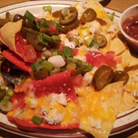TheShackCO's tweet photo. When you’re feeling down, just find your happy plate -- of nachos. https://t.co/PmTy7WXeyp
