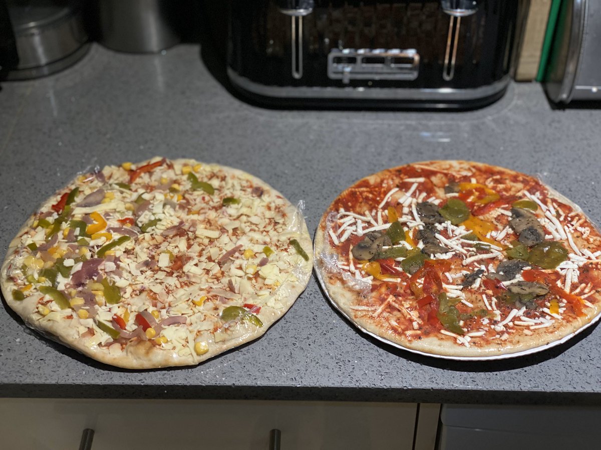 Chadwicknj's tweet photo. @AsdaServiceTeam do you think this is acceptable? Asda Vegan pizza on the right, Asda veggie pizza on the left. Why do vegans only get 10% of the cheese compared to the veggie one? Seems unfair :// https://t.co/ukh490xafb