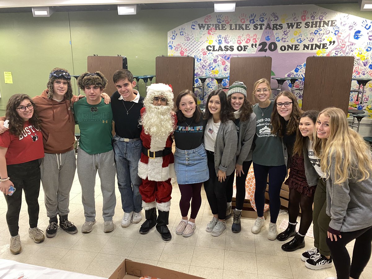 Glenbard West Student Council Exec Board serves holiday donuts to West students. Go West!