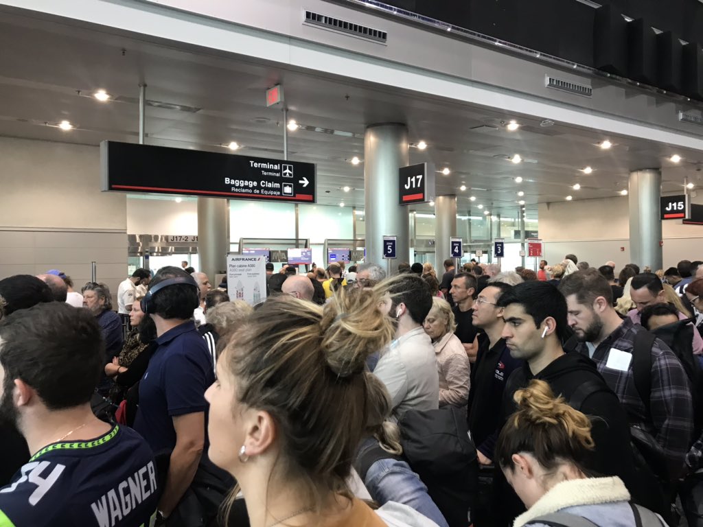 Miami_Sam's tweet photo. @lufthansa and @iflymia...your boarding situation in Terminal J is absolutely ridiculous, and potentially dangerous. There is no organization between Gates 15-18. https://t.co/KK9yU3F3t2