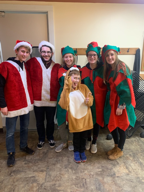 HhsDrumline's tweet photo. Thanks to Gib, Evan, Elle, Kourtney, Lilia, and Jordyn, plus students from @MedinaKeyClub and @mcjvs for joining with @Kiwanis of Medina County's annual Christmas caroling festivities to help raise money for needy kids to go clothes shopping this holiday season! #RollOutAutobots https://t.co/7wGDFakOTt