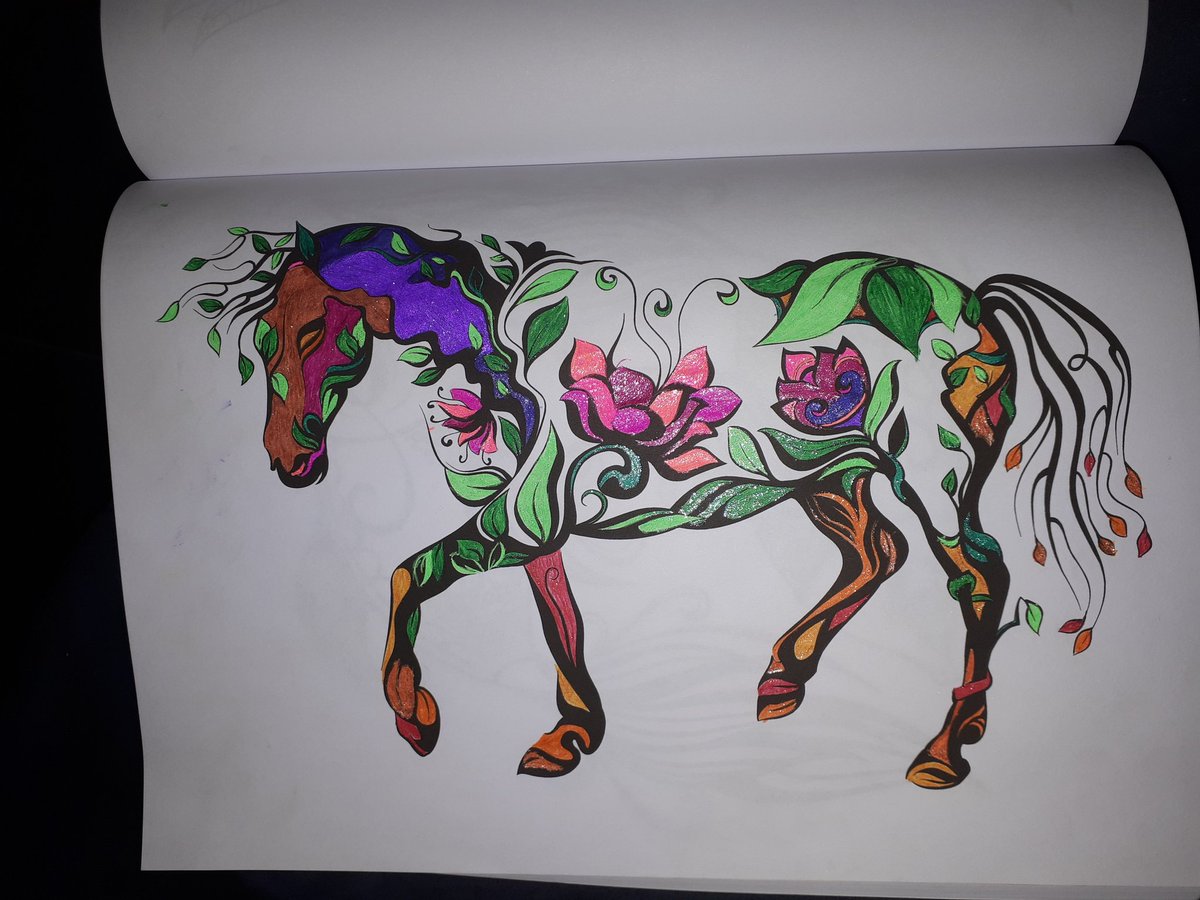 GrooKangaroo's tweet photo. This horse in the Animal Design Adult Colouring Book really grabbed my attention and so was the first design I coloured. I decided to blend the lovely green leaves with some autumn/fall colours and then finished with some pinks and purples for the blooms. #bluestarcoloring https://t.co/UQbqljLSmG
