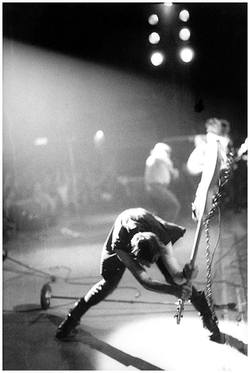 Alex_Ssl1900's tweet photo. Pennie Smith was standing less than six feet away when Paul #Simonon, bass-player with the Clash, smashed his guitar to pieces on stage at the Palladium in New York. She’d been on the road with the band for two weeks, photographing their first US tour > https://t.co/pYj1MtCMZy