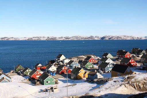 Nuuk, the capital of Greenland.The ubiquitous colourful facades originally had the purpose of communicating a settlement's functions over long distances to passing fishermen. Supply stores, churches and schools were painted red, hospitals yellow and municipal buildings blue...