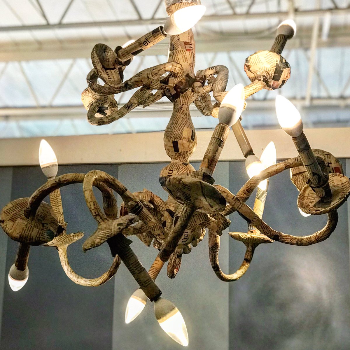 AmeliesBakery's tweet image. Amélie’s Fun Fact: One of the chandeliers that is in front of the fireplace in our Atlanta bakery is covered with French newspapers. #recycleddesign #upcycleddecor #chandelier