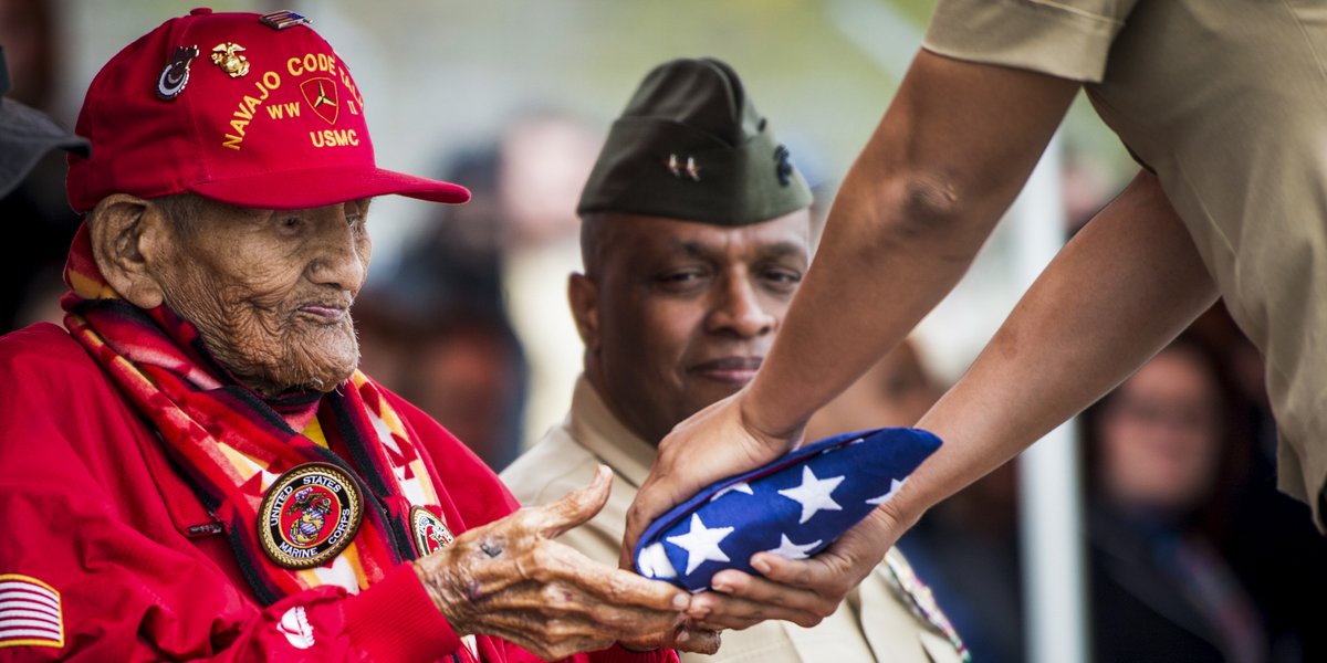 USMC's tweet photo. Honoring a Legend

April 4, 2014: Cpl. Chester Nez receives an American flag at Code Talker Hall, @MCB_Quantico, from Pfc. Tiffany Boyd.

Cpl. Nez is the last of the original 29 Navajo Code Talkers of World War II.

#MarineCorpsCountdown https://t.co/8O6kSCswh3