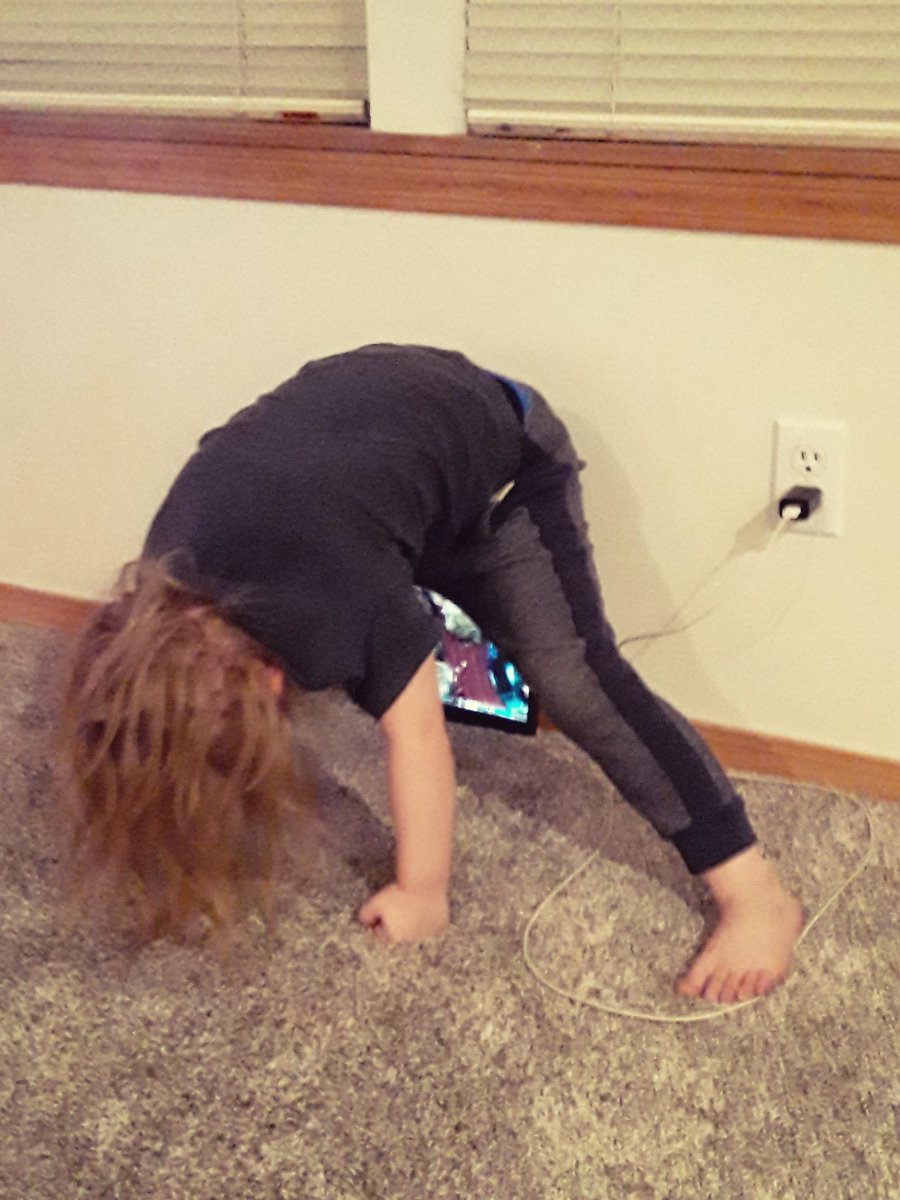 ZombieLoveasmr's tweet photo. Apparently I have been watching shows wrong all these years. Being upside down, must enhance the show watching experience. My son has shown us the way of watching a tablet. #kidhack #parenting https://t.co/RMsgFW3qIP