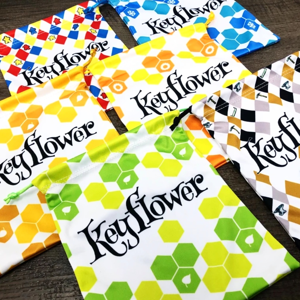 BoardGameGeek's tweet photo. A set of six drawstring bags for use with Keyflower. These are sublimation printed microfiber bags, with the bags measuring 18 cm deep by 15 cm wide. Available now in our https://t.co/iapyNIKRTK! #keyflower #keyflowerbag #geekstore #GeekUpBits #bgg #boardgamegeek #accessories https://t.co/D6PtO4fO5s