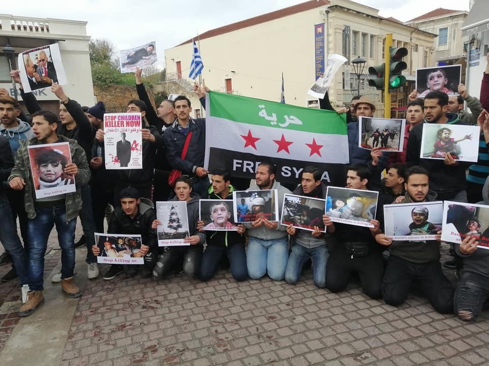 asaadhanna's tweet image. People in Greece standing under the rain to show their support to the civilians in #Idlib
#IdlibisUnderFire