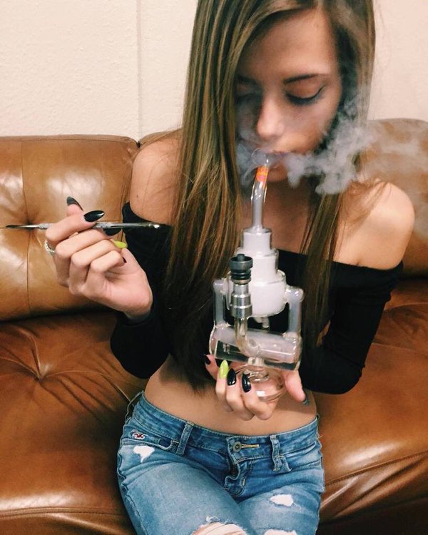 Sexy teen girl smoking weed.