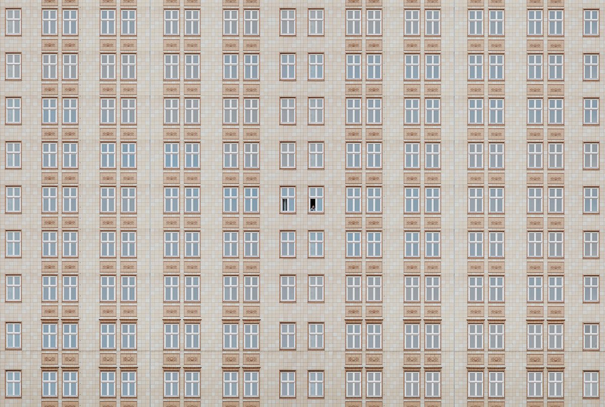 Adobe's tweet photo. Using geometry as a guide, photographer Gustav Wilet creates stunning frames to highlight humans. See for yourself: https://t.co/NjeMynP2LT https://t.co/edC4iTknAj