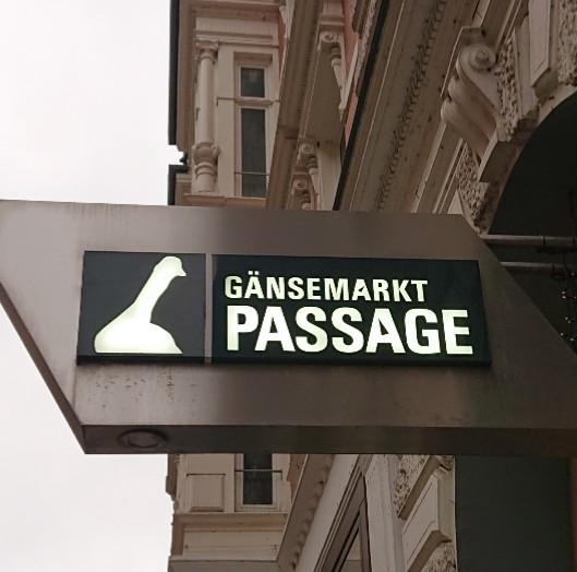 Gänsemarkt Passage sign in Hamburg features the outline of a goose.