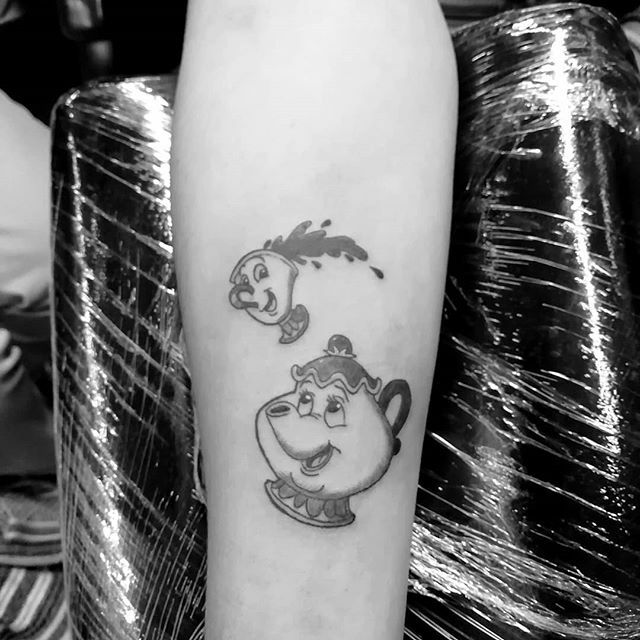 Mrs Potts tattoo hand poked on the inner forearm