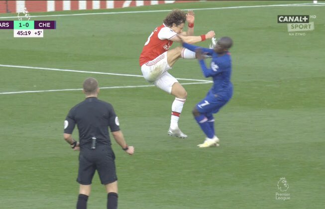 caitlinjmx's tweet photo. David Luiz does this to Kante and Kante just stands there looking confused. If this was any other player they’d be crying for a foul on the floor or there’d be a brawl. The nicest man in football Kante is! #ARSCHE #chelsea https://t.co/GfG4iT8Dbz