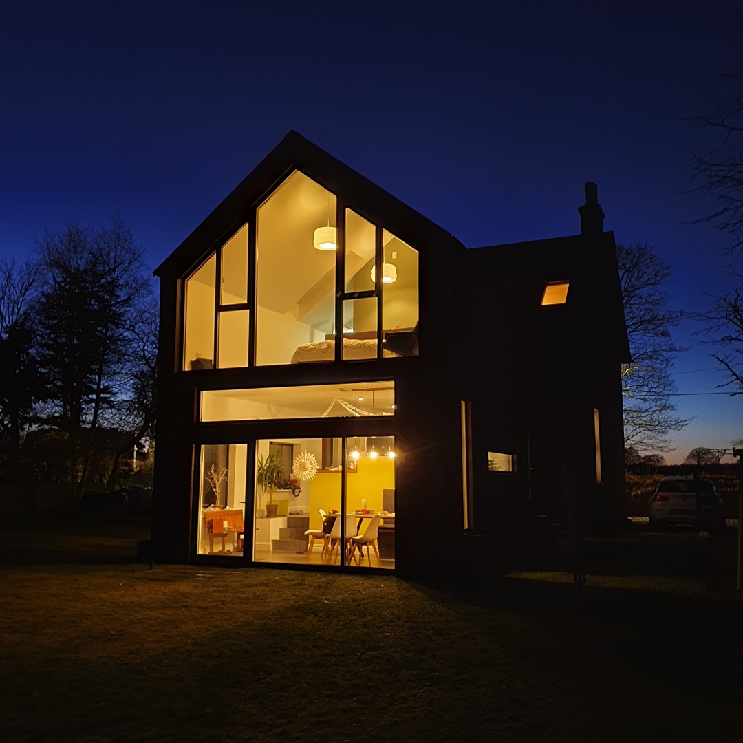 JA_Architects's tweet photo. Popped in to see how our recently completed extension near Biggar is looking. We haven't seen it yet at night with all the lights on, and it didn't disappoint. It's a good job it enjoys a very private outlook. #ScottishArchitecture #Houseextensions #glazedgable #goldfishbowl https://t.co/xVeHd8tGLa