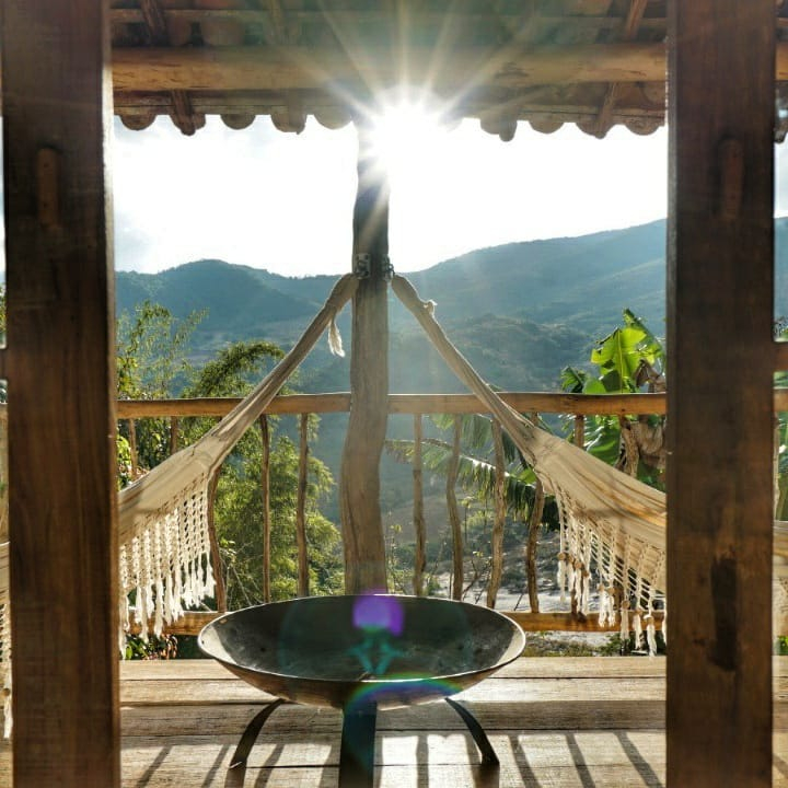 A lazy afternoon with one of the most beautiful views at #ComunaDoIbitipoca ☀️