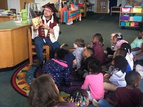 DLInitiatives's tweet photo. Pirate Ted Johnson, pastor of Warrington United Methodist reading A Pirate’s Twelve Days of Christmas to Pre-K, K, and 1st Grade Students of Warrington Elementary. Each student received their very own copy. Celebrating a love of reading! https://t.co/kaweVga8WZ