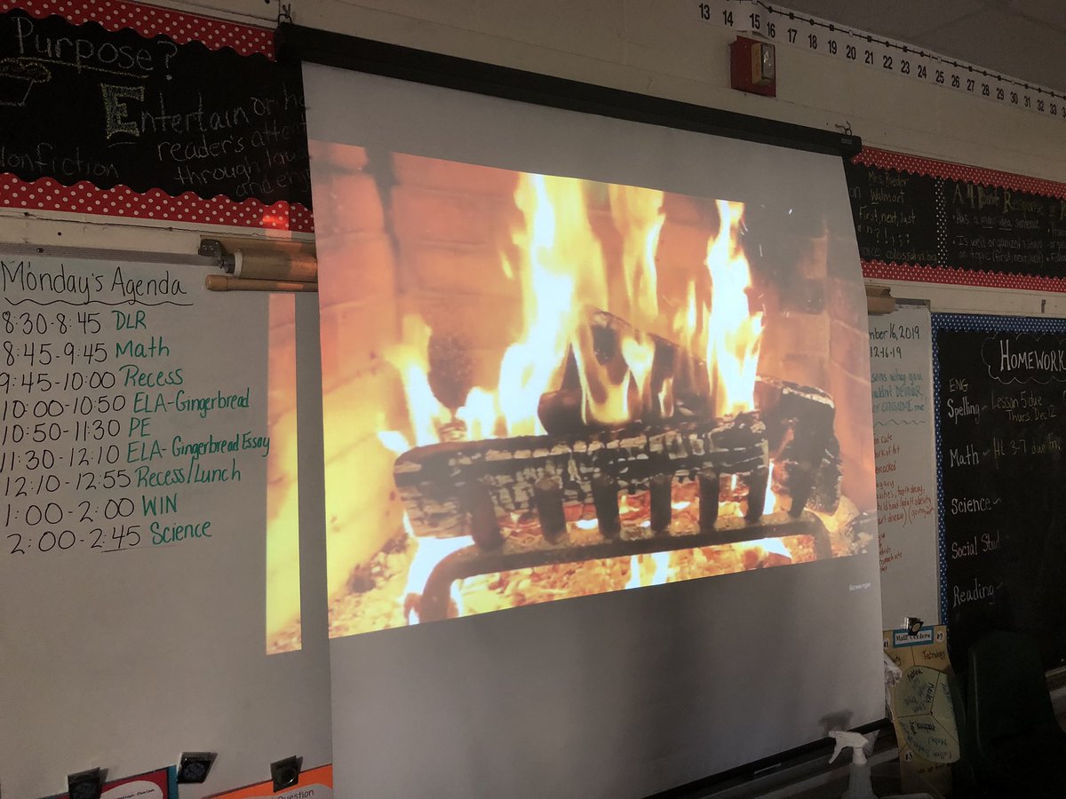 4RoederLSS's tweet photo. Who says you can’t make a classroom cozy?  Writing gingerbread cookie persuasive essays by a crackling fire.  @4RoederLSS @ExeterLSS https://t.co/DB6Aus4Gyv