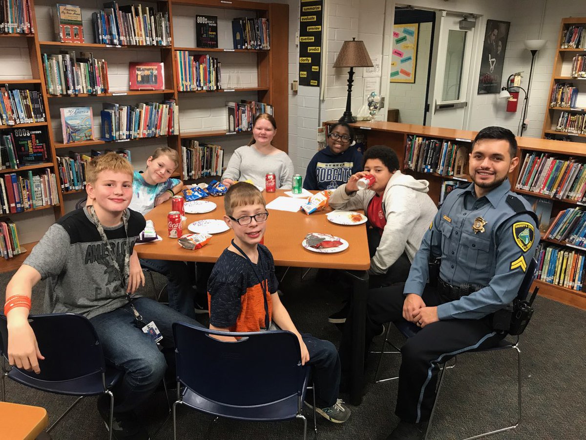 SenecaMiddle's tweet photo. 6th Grade Book Club enjoyed a pizza lunch while discussing their chosen book today. They were super excited to have Officer De Luna Soto join in on the celebration. #catsread #senecamiddle https://t.co/O7DbbTIMK9
