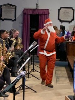 LipsonAcademy's tweet photo. Santa popped in during the last number. Our Headteacher and Rev Tim (from St Judes) offered some thanks and thoughts for the Christmas period. https://t.co/Nqqi8DftWE