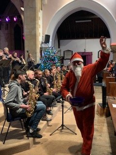 LipsonAcademy's tweet photo. Santa popped in during the last number. Our Headteacher and Rev Tim (from St Judes) offered some thanks and thoughts for the Christmas period. https://t.co/Nqqi8DftWE