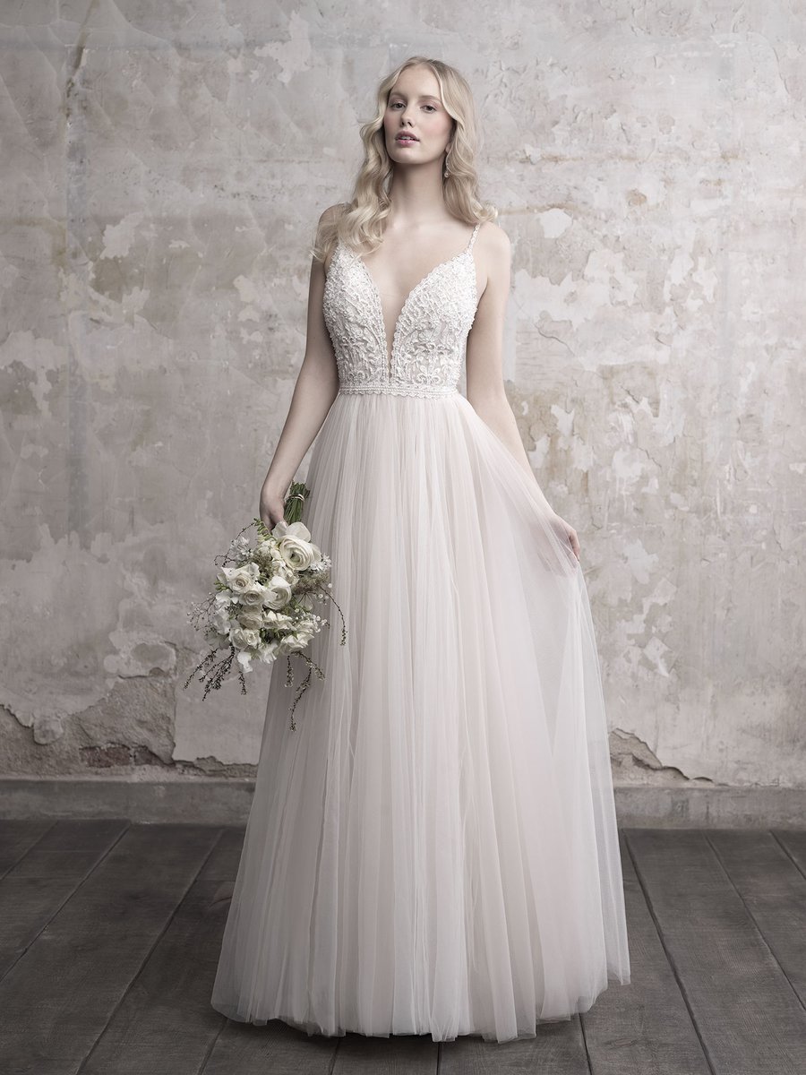 New Arrival from #MadisonJames a romantic gown with a deep sweetheart neckline lends drama to this A-line tulle gown #weddingdress