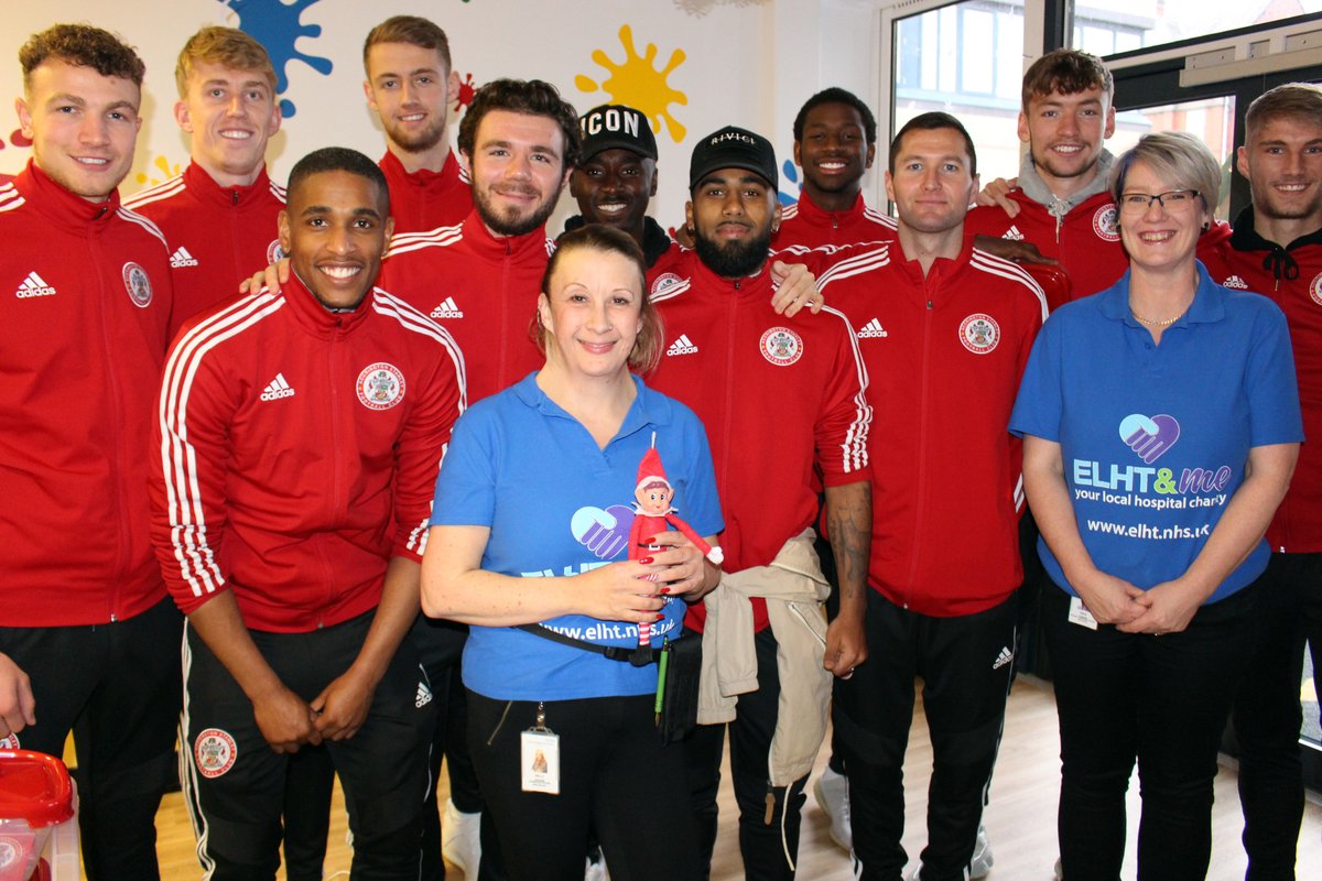 ELHT_NHS's tweet photo. Accrington Stanley players visited the Children's Unit at Royal #Blackburn Hospital yesterday, and #Elbert got to say hi! Stay tuned for more antics with Elbert the #elf, and how to get the right service for you this #Christmas! #ElfsHealth #NHS #MaketheRightcChoice #StayWell https://t.co/lbDBNmudEv