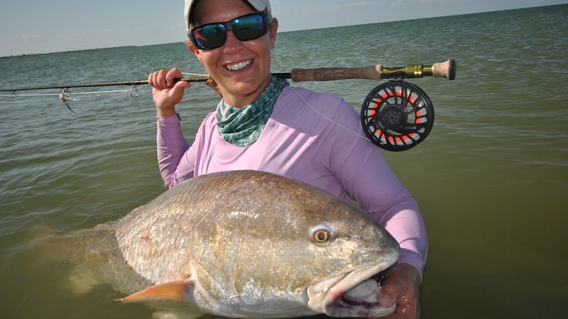 Woman holds large red drum