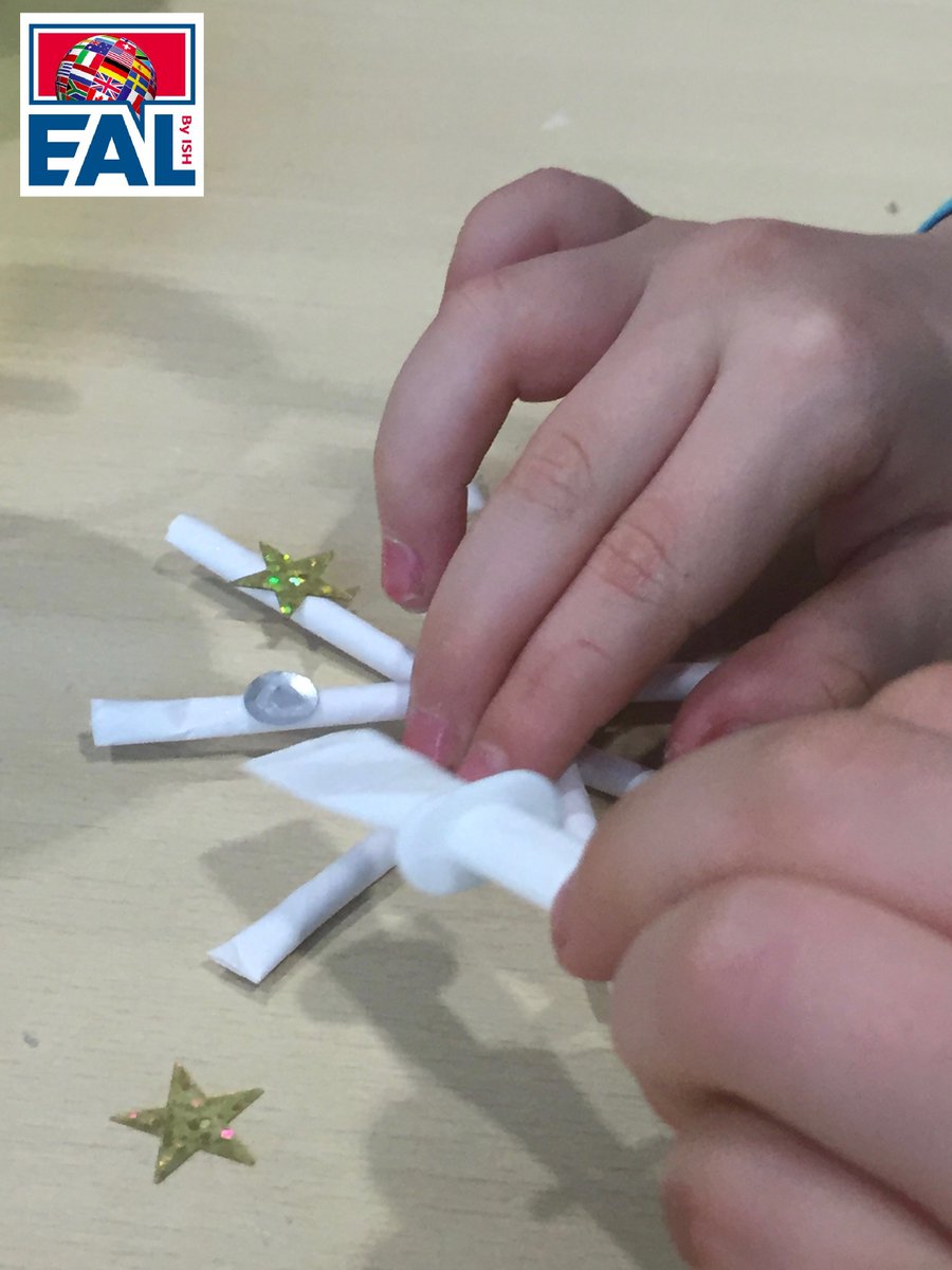 ISH_EAL's tweet photo. How can you integrate #IPC Technology, #Writing and Winter celebrations in one activity? Y2 #EAL students read and followed instructions to make their own star decoration to hang on a pine branch. They found the labelled diagrams a big help, pictures speak louder than words. https://t.co/hOZmeGS8OT
