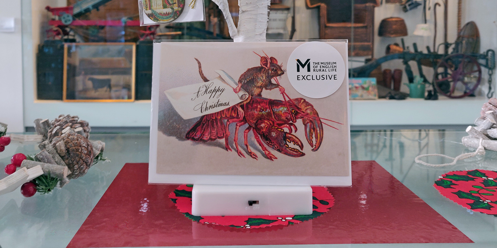 A photo of a card in our museum shop: it's a mouse on a lobster! A classic rural English encounter.