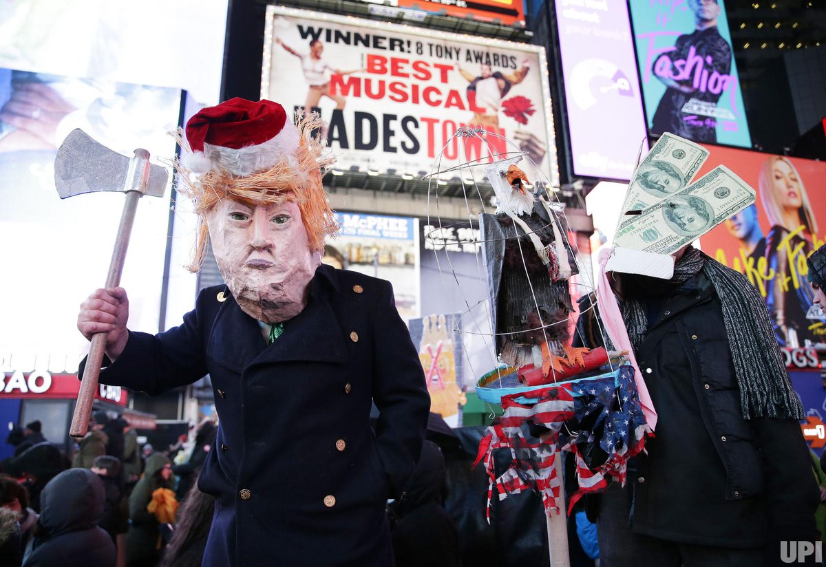 UPIPhotos's tweet photo. Protesters hold signs at the #MarchForImpeachment in Times Square on Dec. 17, 2019 in NYC. The House is moving closer to impeaching @realdonaldtrump and a historic debate will take place on Wednesday over Trump's conduct toward Ukraine. Photos by John Angelillo for @UPI. https://t.co/3nlOCF10Fb