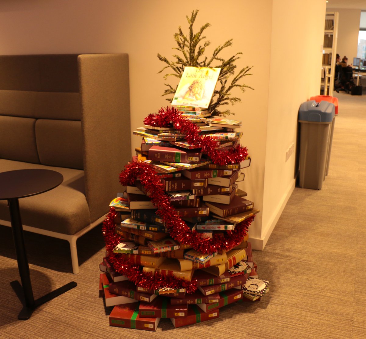 edgehill's tweet photo. How creative is this Christmas tree in @CatalystEHU? It's made out of books and even has an angel on top! 📚👼 #ChristmasAtEHU https://t.co/kXQG3Rr6In