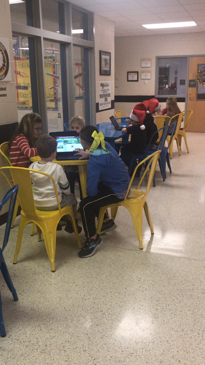 Fourth graders teaching kindergarteners coding!