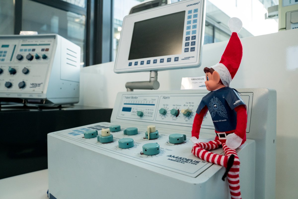 HamiltonMedical's tweet photo. #ElfOnTheShelfatHamiltonMedical Our #elves discovered the #ventilator #museum, home to previous generations of #intelligent #ventilators manufactured by Hamilton Medical since 1983. They even crafted themselves a #VentilationGeek t-shirt to be adequately dressed for the occasion. https://t.co/FfxStaEwPz