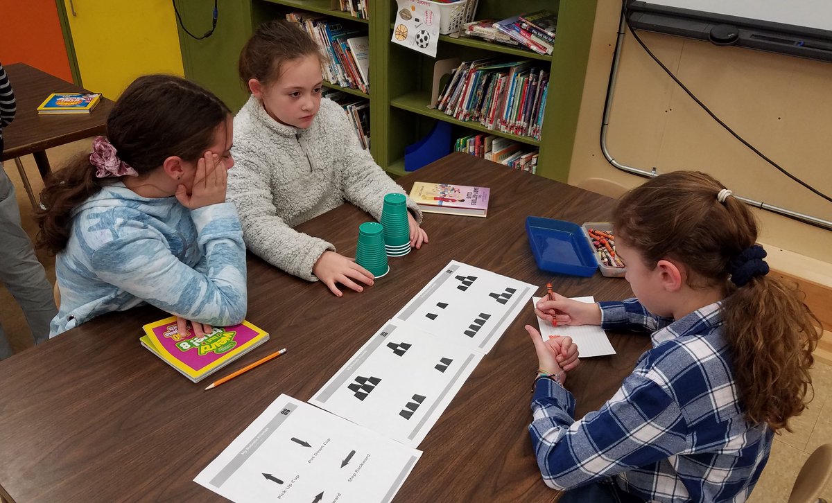 CranstonSchools's tweet photo. The 4th and 5th graders at Garden City and Oaklawn Schools participated in an "unplugged" Hour of Code coding activity. They had to write instructions for building a tower of cups using symbols. #computersciencemonth #cpsed @mercolleen @bbyerlee @JeannineNota https://t.co/QOmFotQPt6