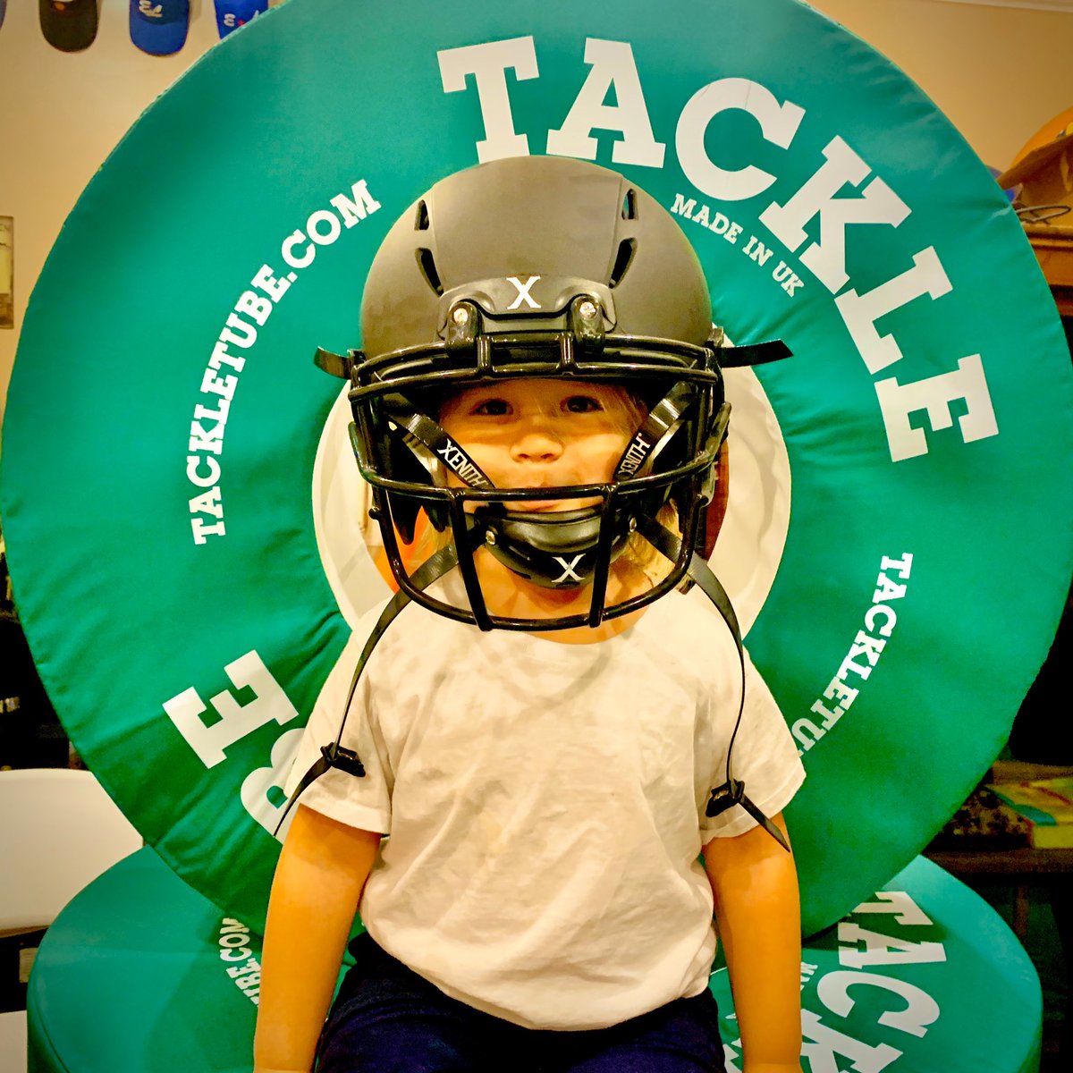 My 4-year old grandson wanted to put on a @XenithFootball helmet this morning. If he decides to play football one day, he will be Great at Tackling if I have a say... and I do!  Keep them safe. Train them right. #TackleTube